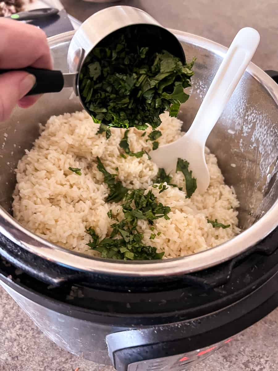 Add cilantro to instant pot cilantro lime rice.