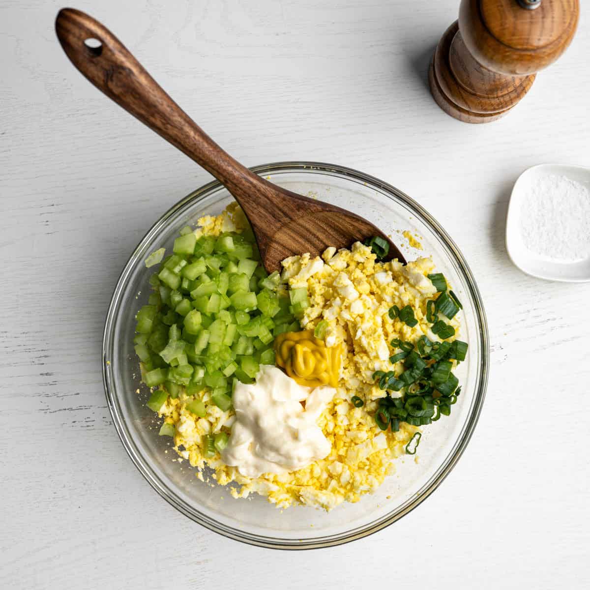 all ingredients in a bowl with a spoon before mixing together.