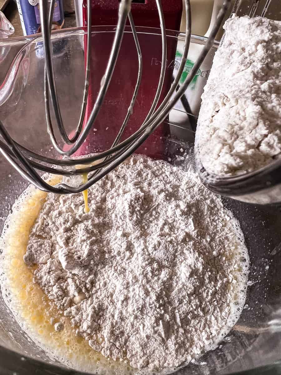 flour added to egg mixture in mixer bowl.