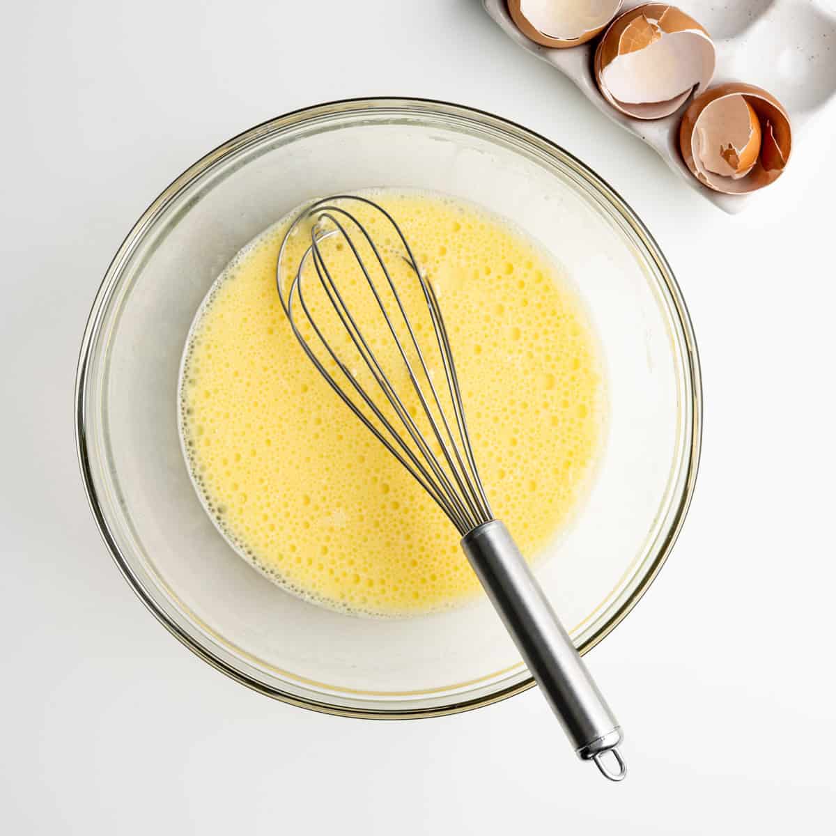 wet ingredients in a large bowl with a whisk.