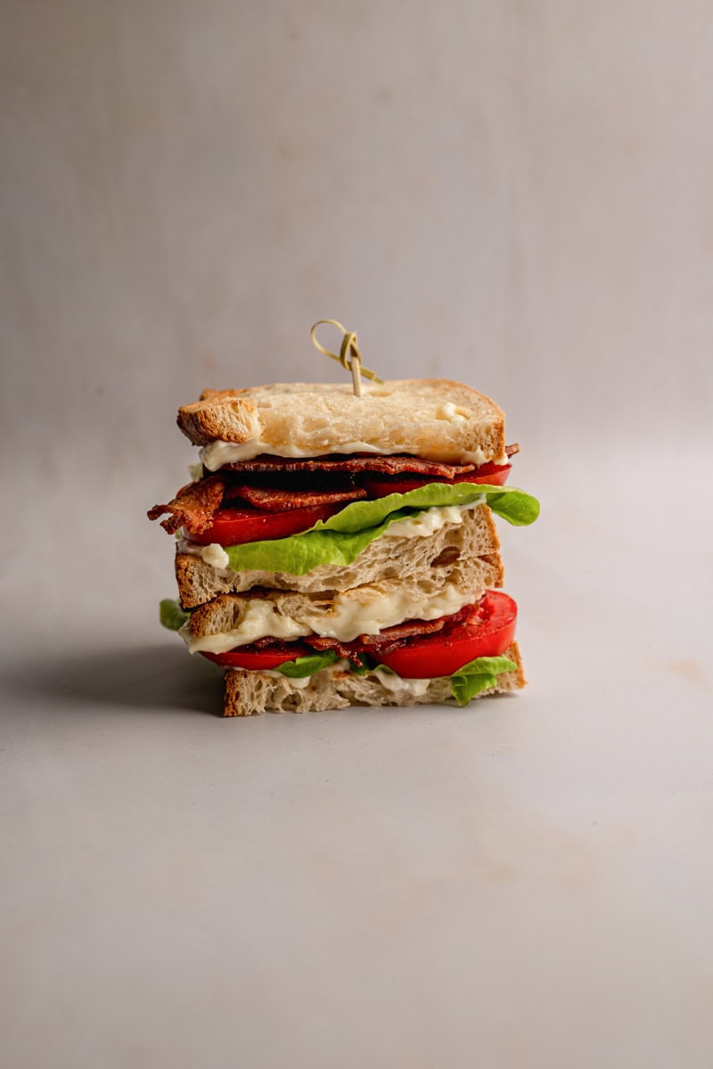 stacked BLT sandwich made with cottage bacon, tomatoes and lettuce. 