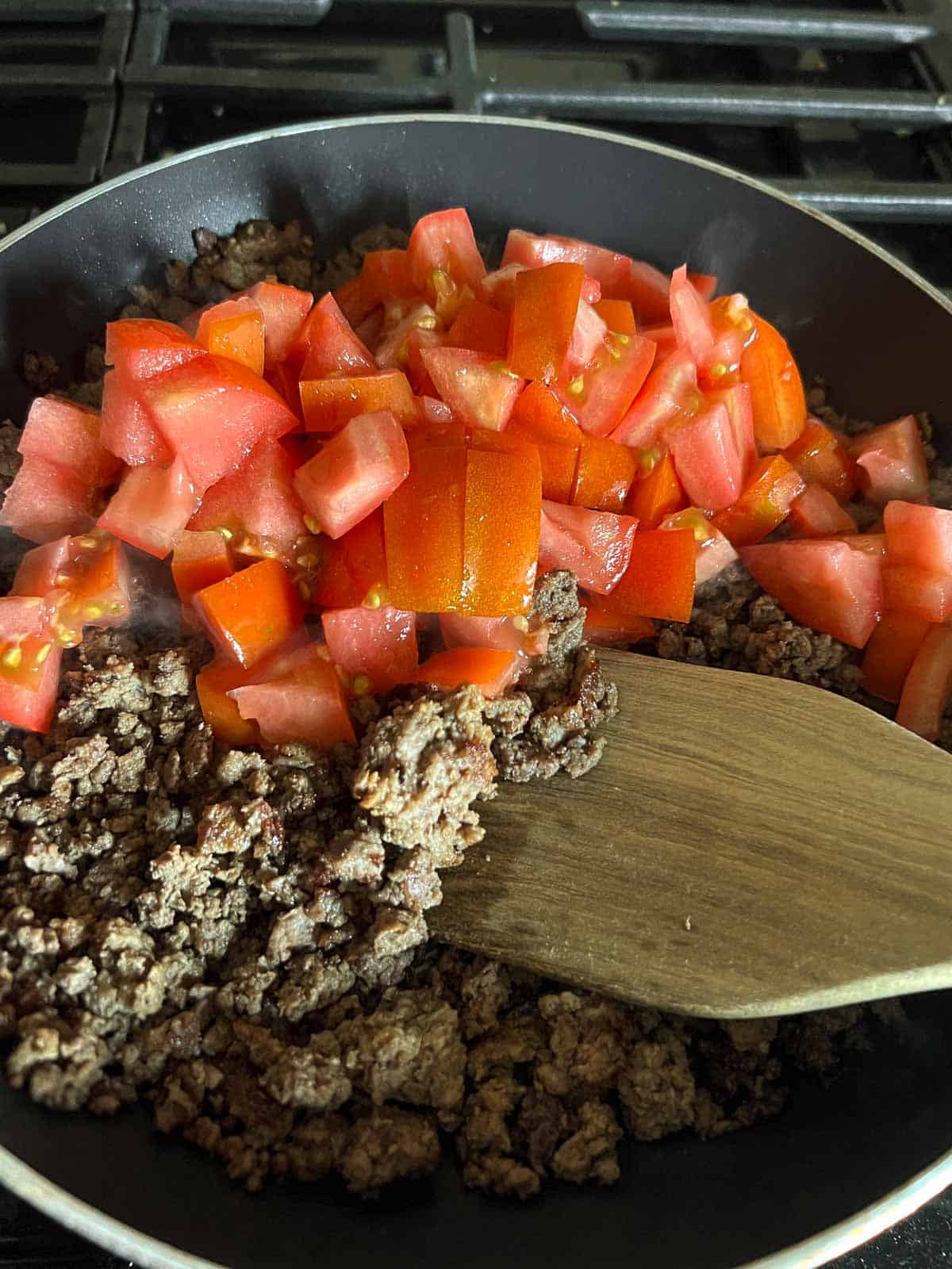 diced tomatoes and cooked ground beef in skillet. 
