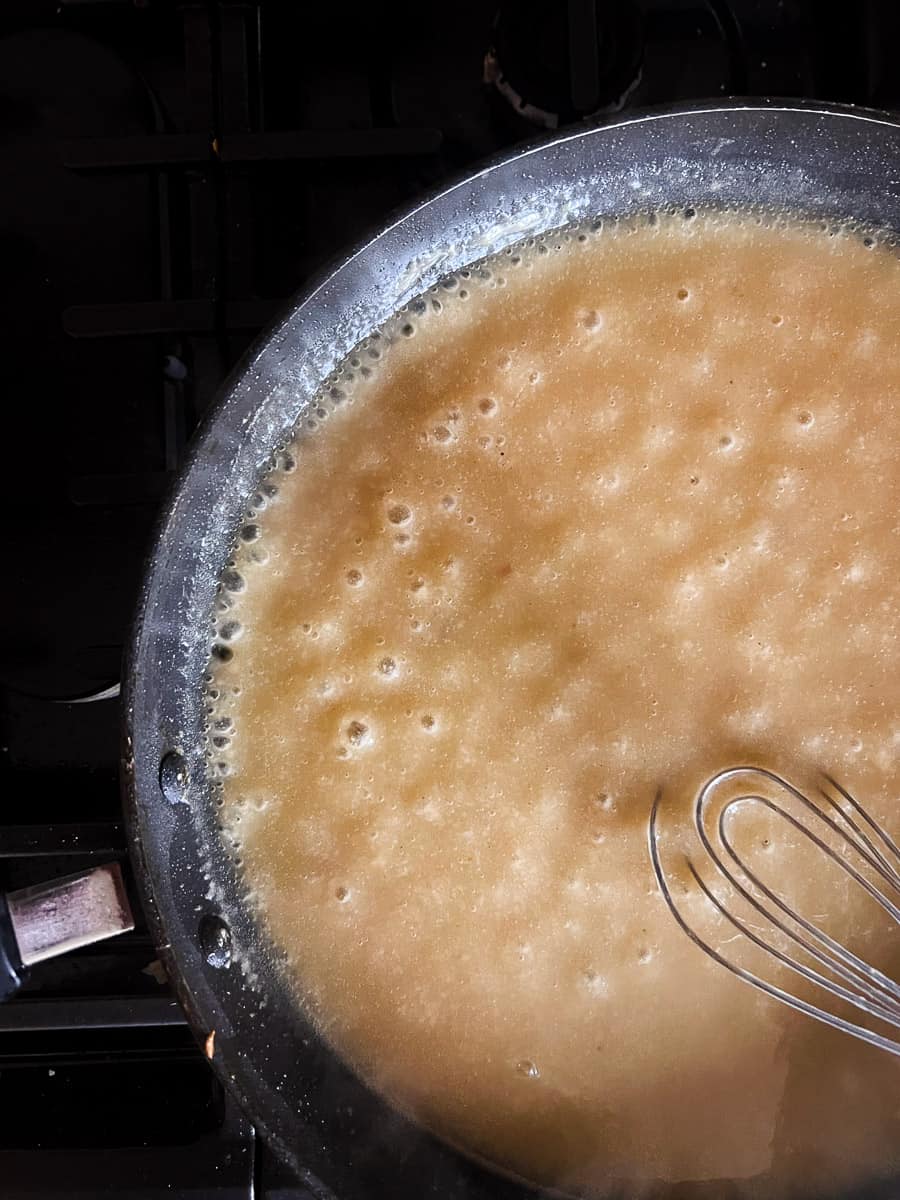 bubbling sauce in skillet.