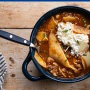 bowl of lasagna soup with noodles and cottage cheese mixture.