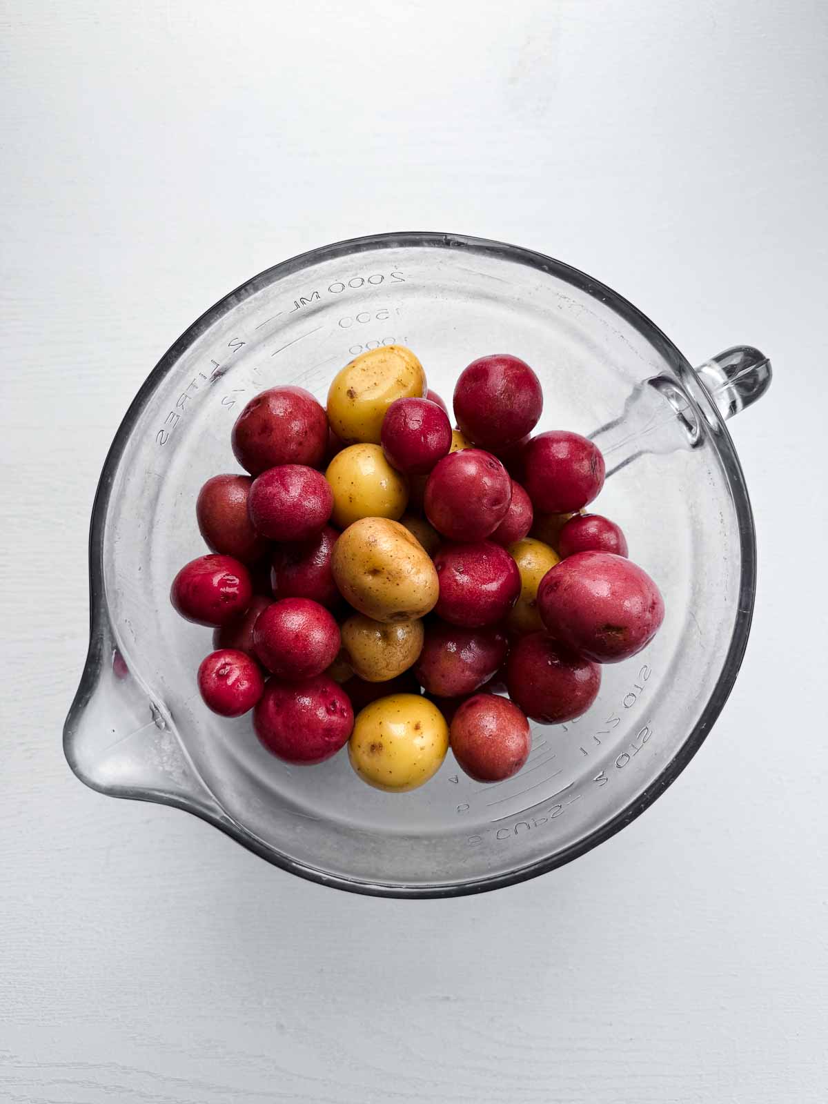 glass bowl with baby potatoes.