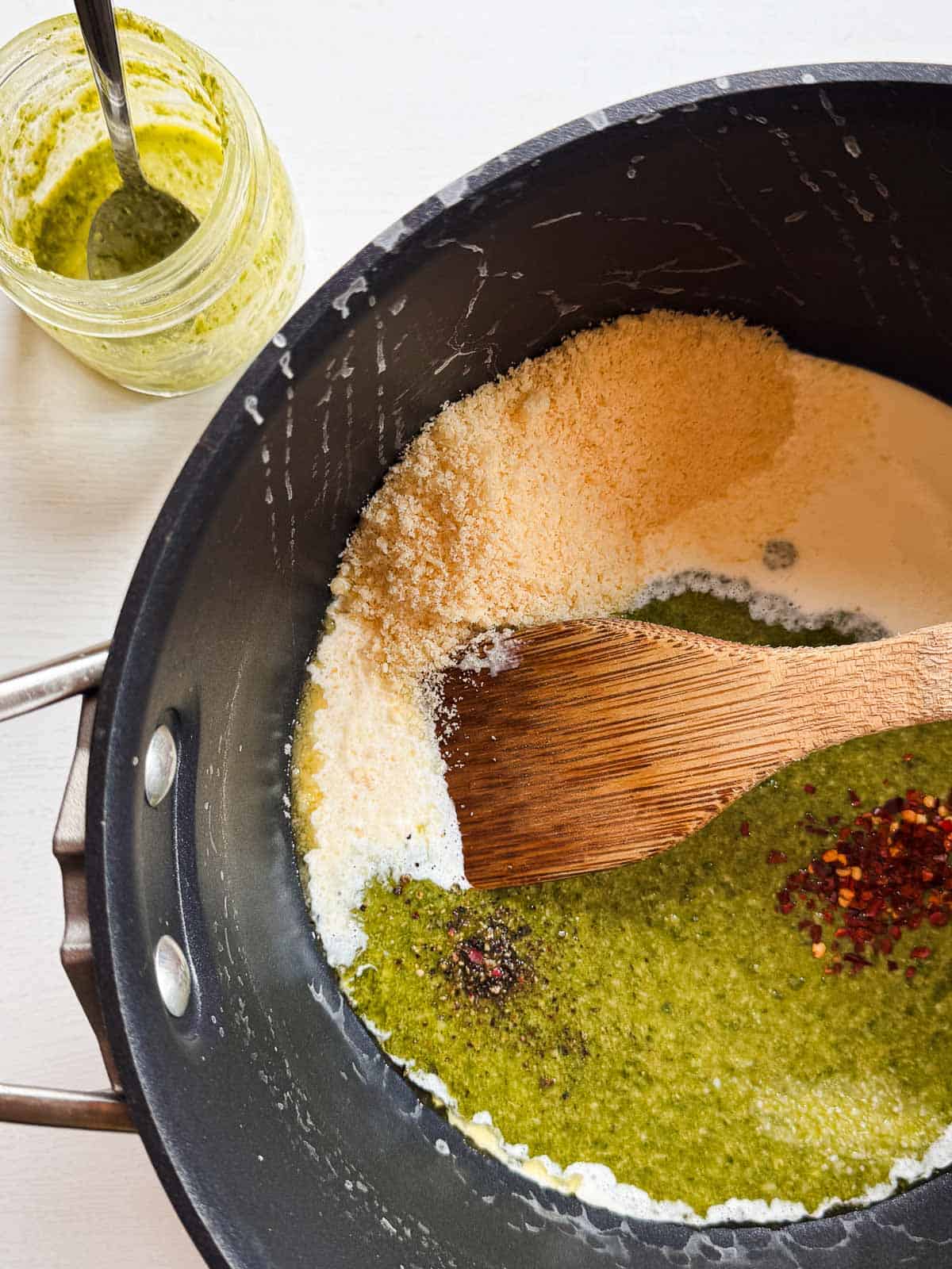 black pot with all the ingredients for the pesto sauce.