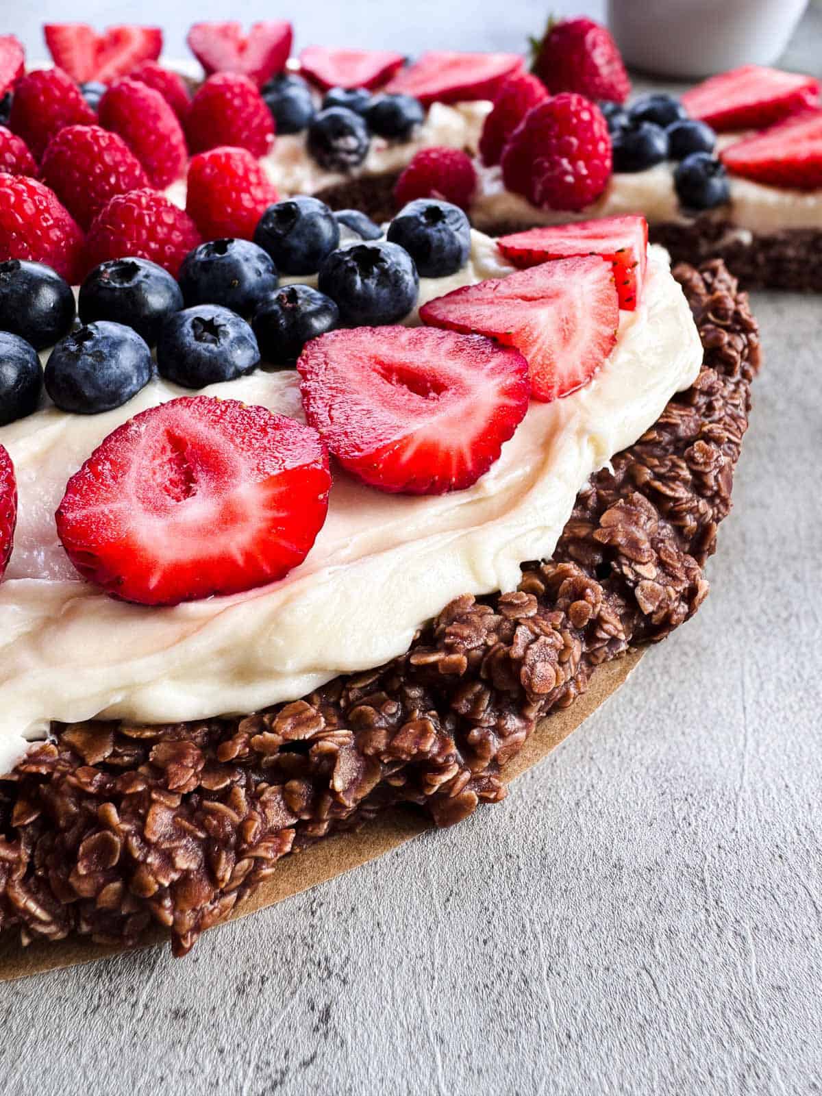 close up of no bake fruit pizza chocolate oat crust.