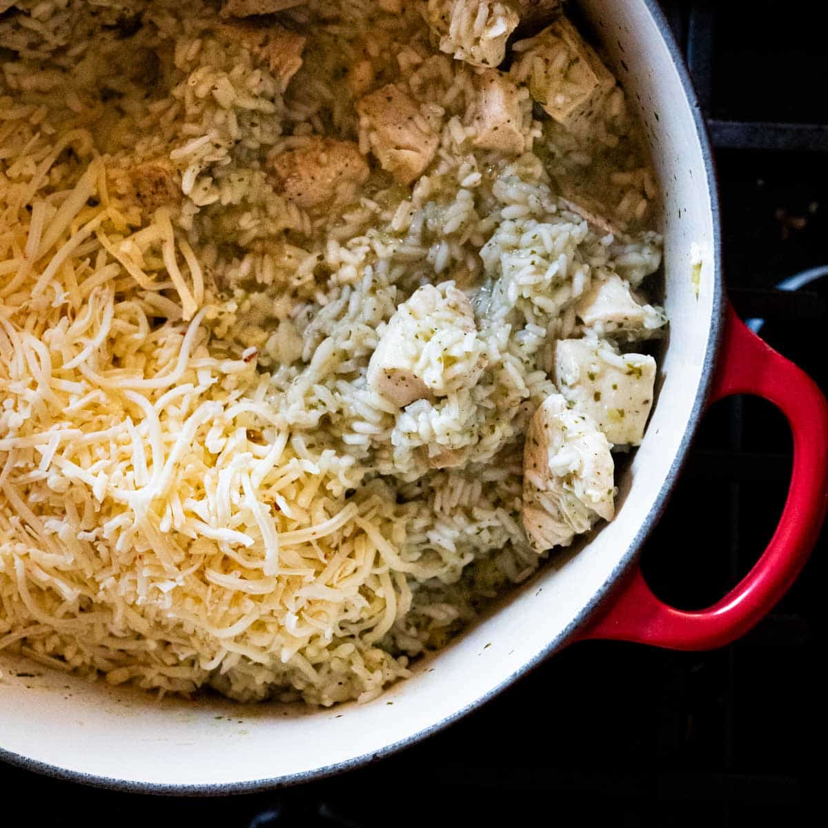 added shredded cheese to the cooked chicken and rice.