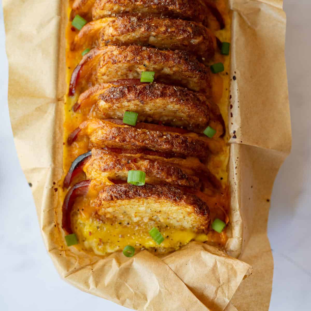 baked hash brown patty casserole topped with green onions.