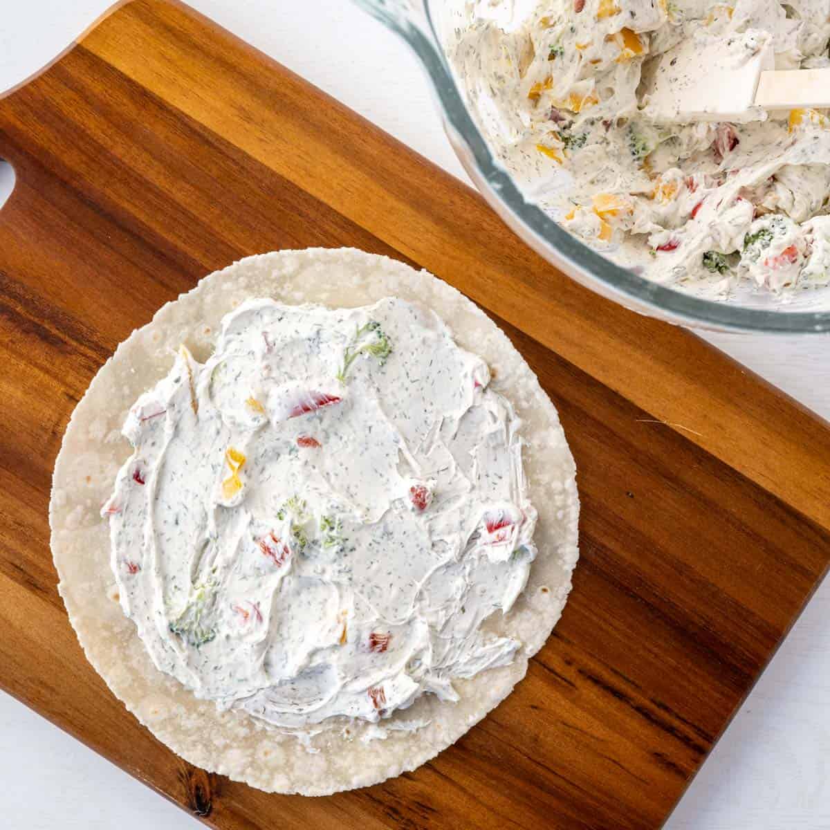 gluten free tortilla with a layer of the creamy filling.