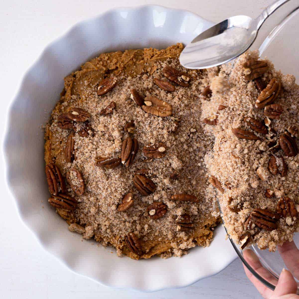 pecan topping sprinkled over the pumpkin cake batter.