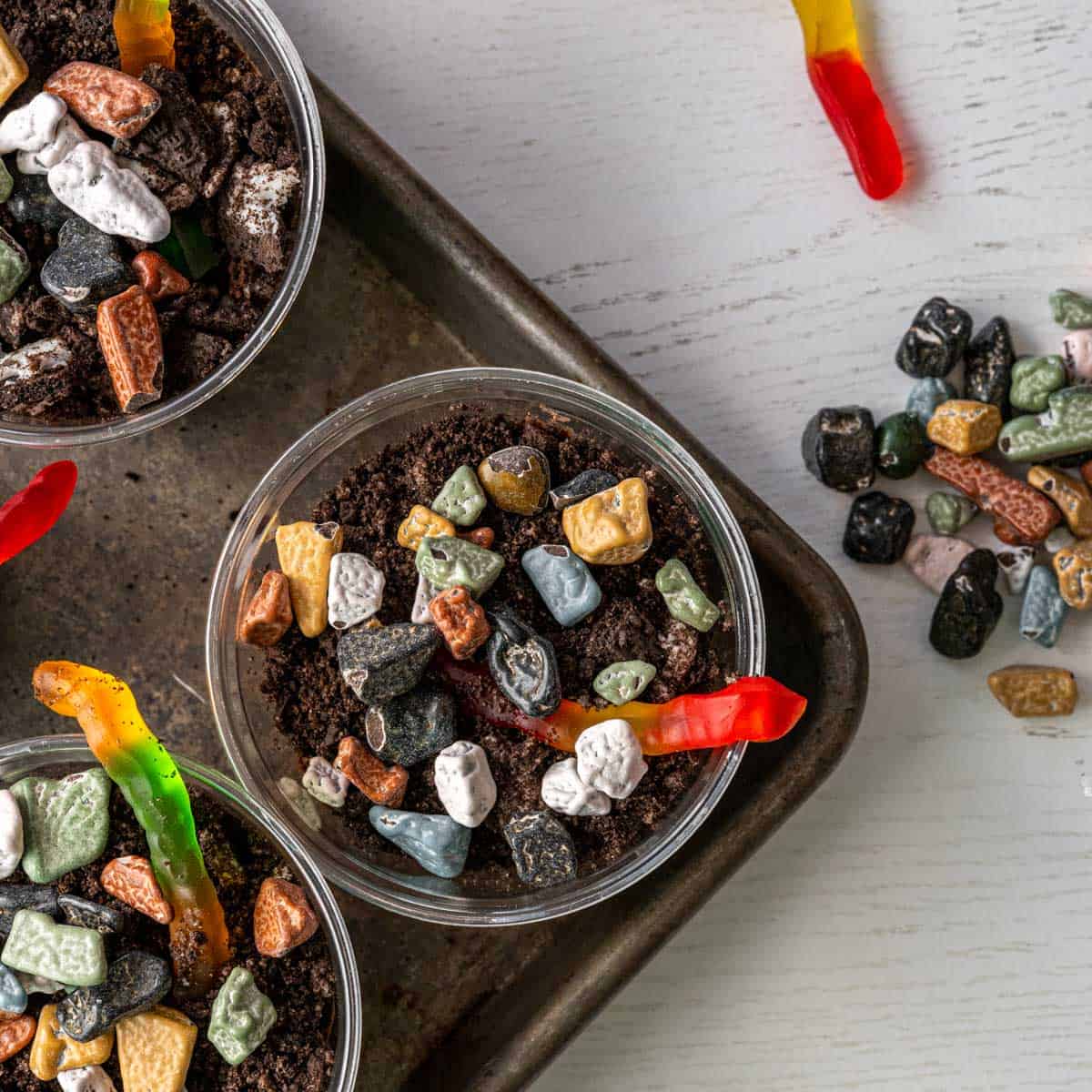 top down view of the finished dirt cups with candy rocks and gummy worms.