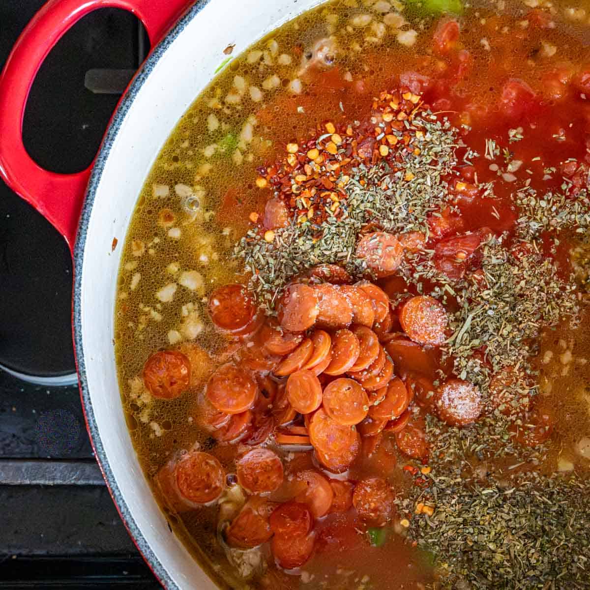 all the soup ingredients but the cheese in a large dutch oven on the stove top.