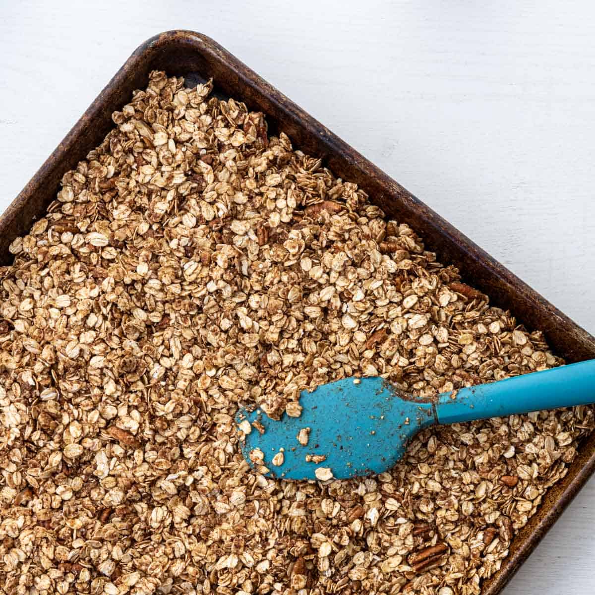 baking sheet with pressed in granola before baking.