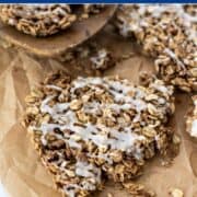 clusters of cinnamon roll granola on a piece of parchment paper.