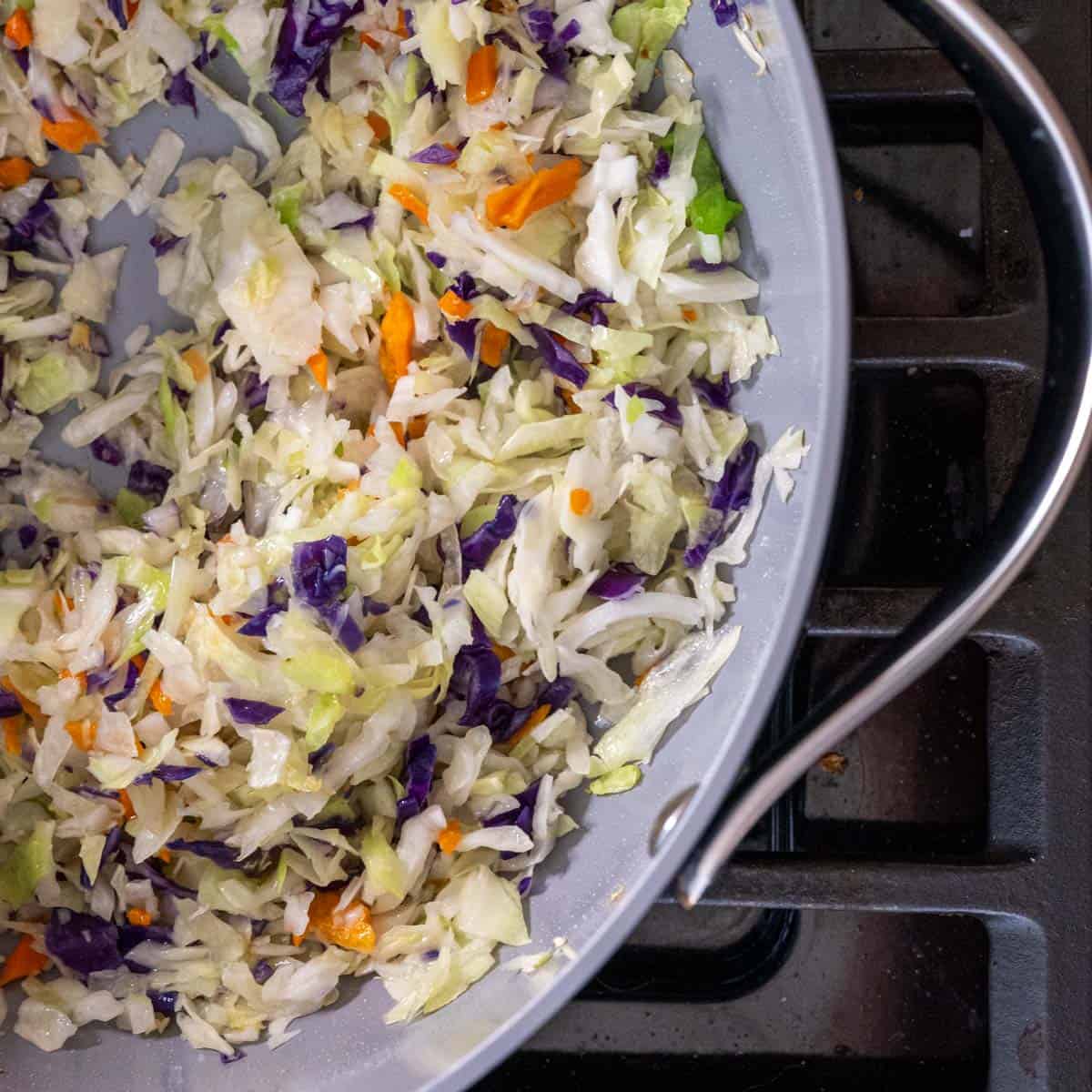 chopped veggies in a skillet on the stovetop.
