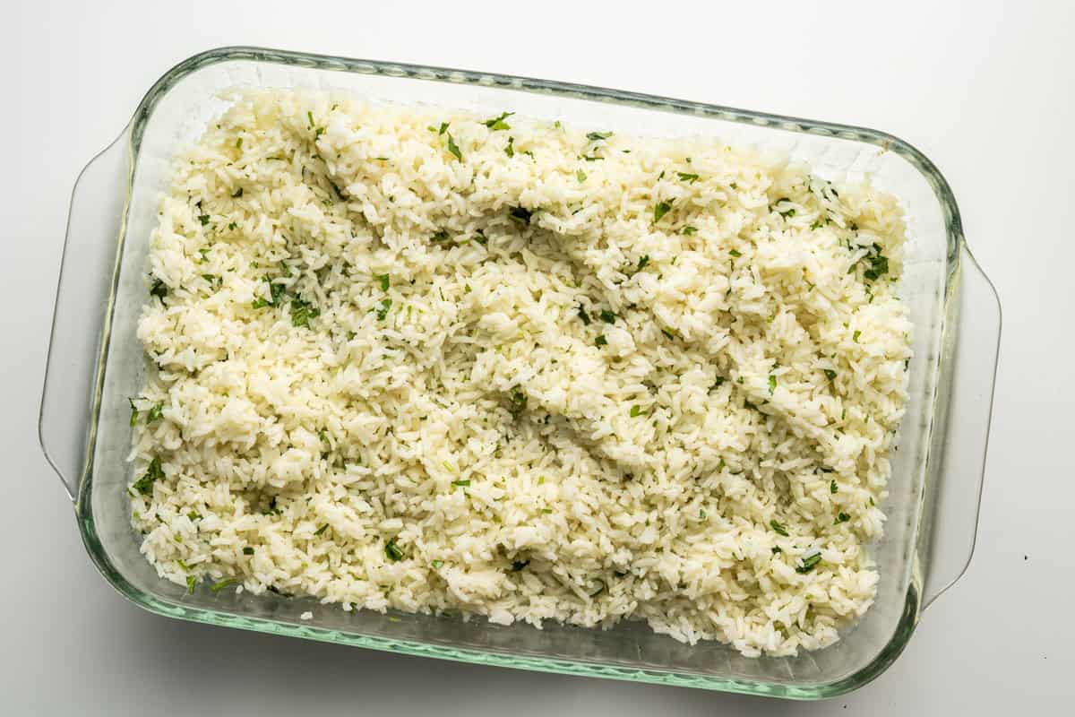 mixed and ready to go is a pan of cilatnro lime rice.