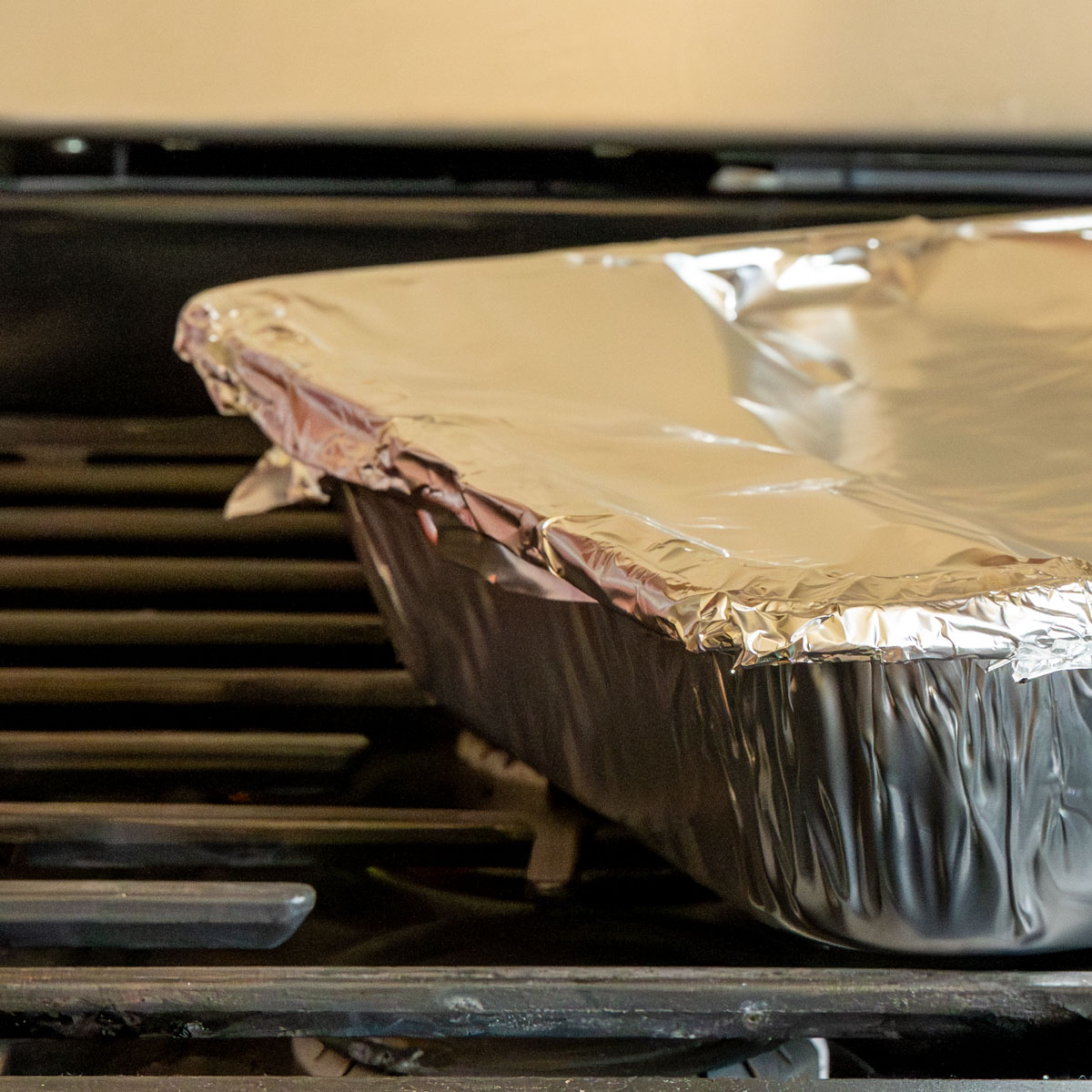 a disposable steam pan covered tightly with aluminum foil.