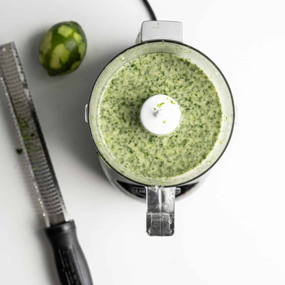 blended cilantro lime marinade with a zested lime and microplane.
