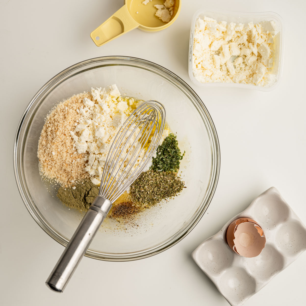 the meatball filler ingredients in a large glass bowl.