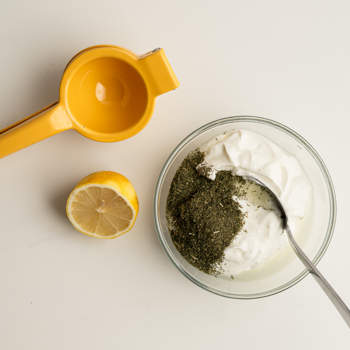 the sauce ingredients next to a citrus juicer.