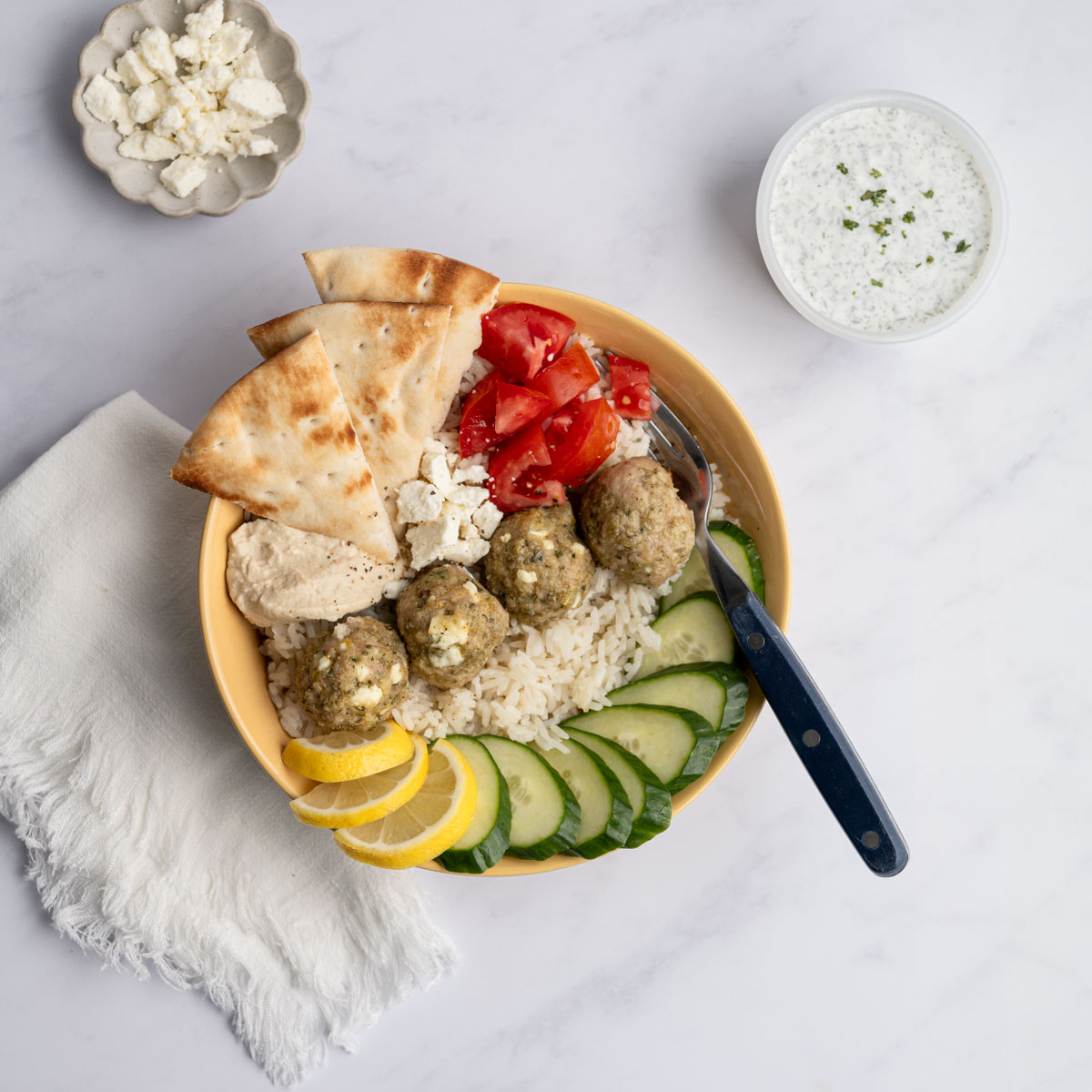 chicken meatball rice bowl with toppings.