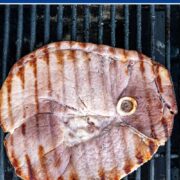 ham steak on a grill.