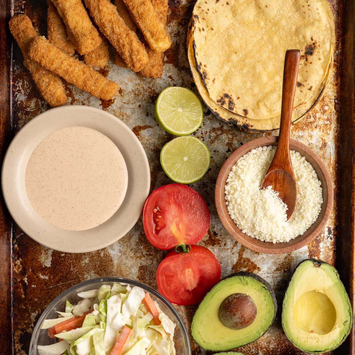 all the fish taco components on a board, read to assemble.