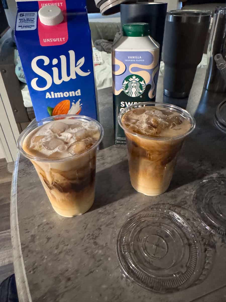 two iced coffees with almond milk and sweet cream.