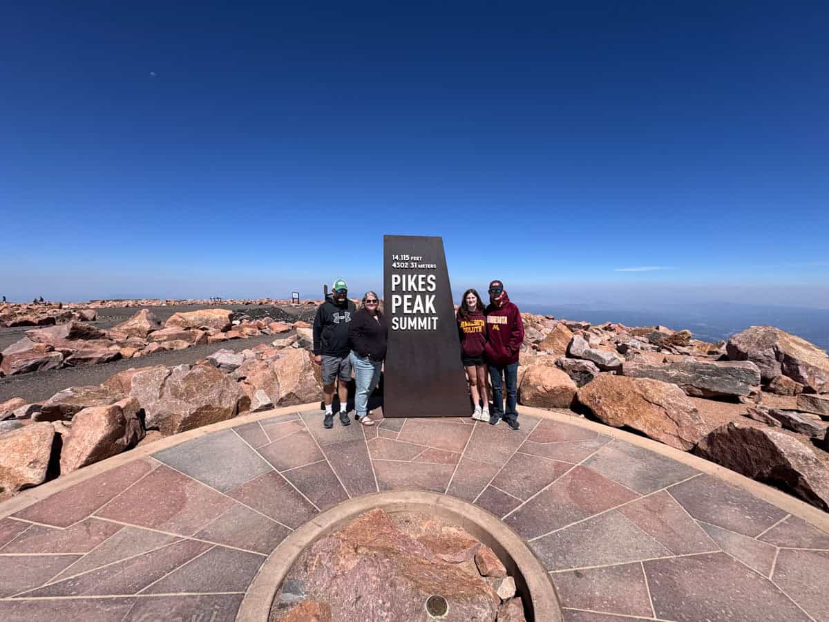 family at the summit of pikes peak.
