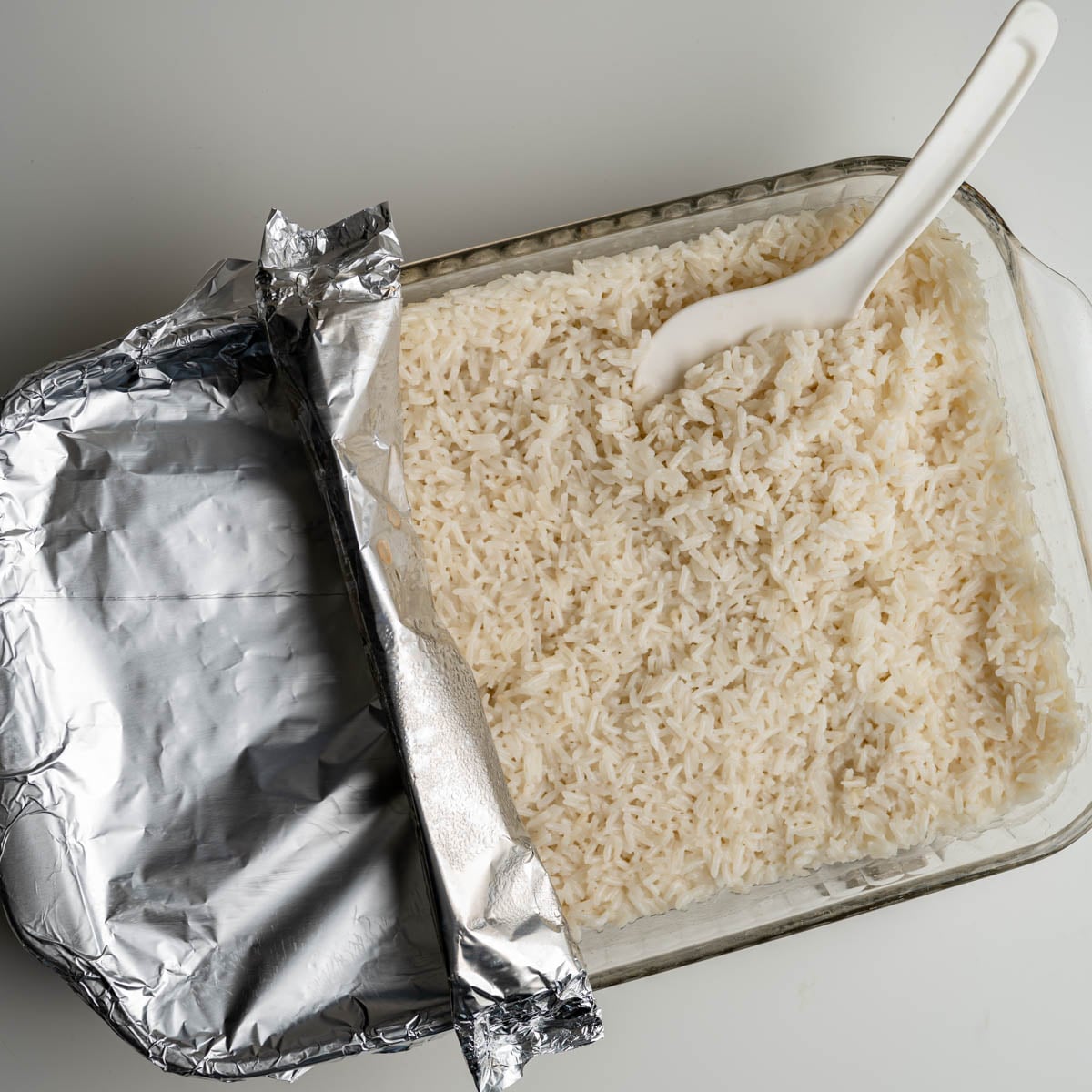baked rice with alumiumn foil folded back.