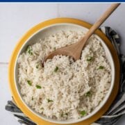 bowl of baked rice with a wooden spoon.
