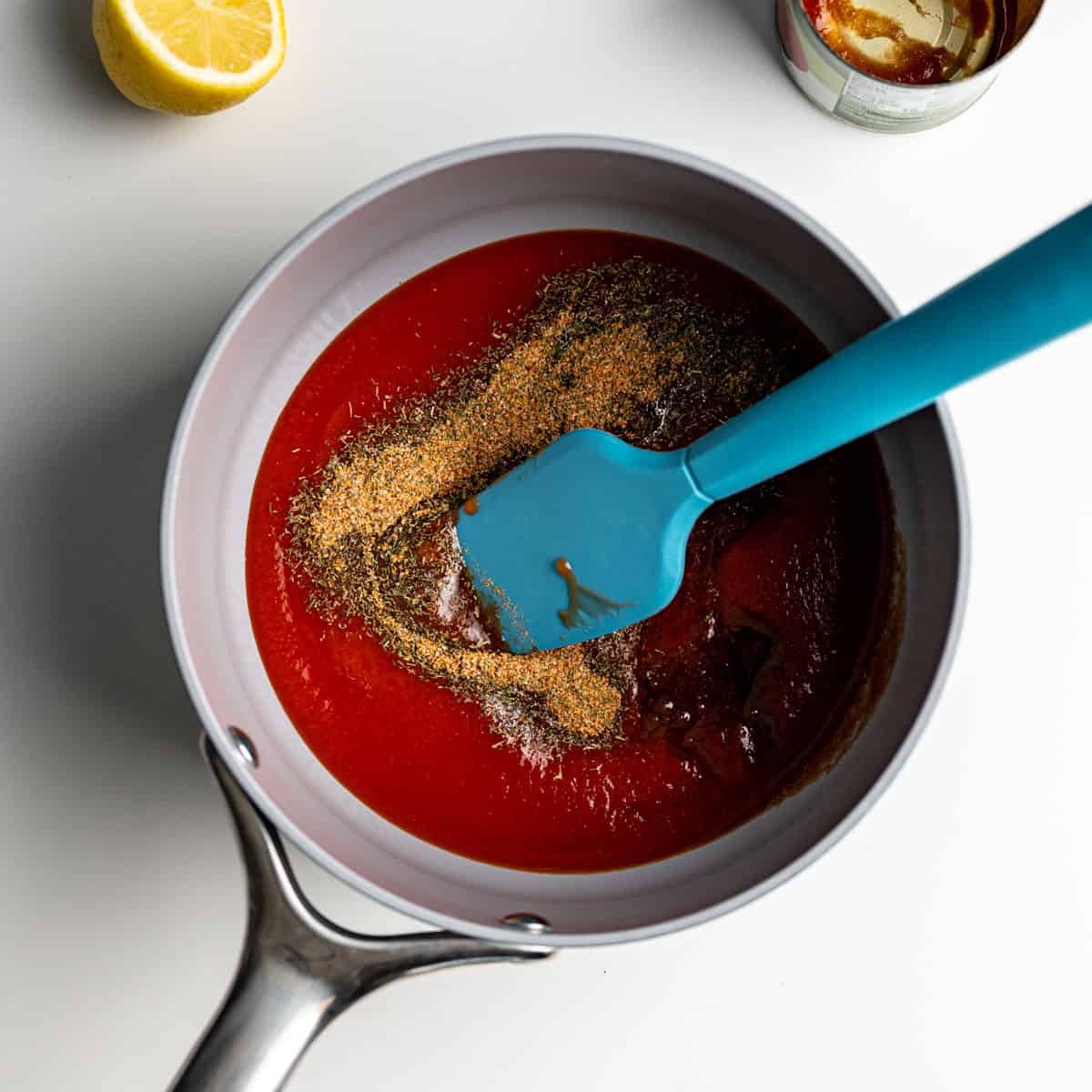 saucepan filled with ingredients to make bloody mary ketchup.