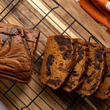 sliced pumpkin bread to show the chocolate swirl.