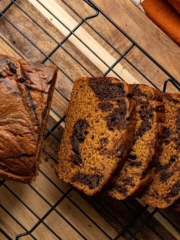 sliced pumpkin bread to show the chocolate swirl.