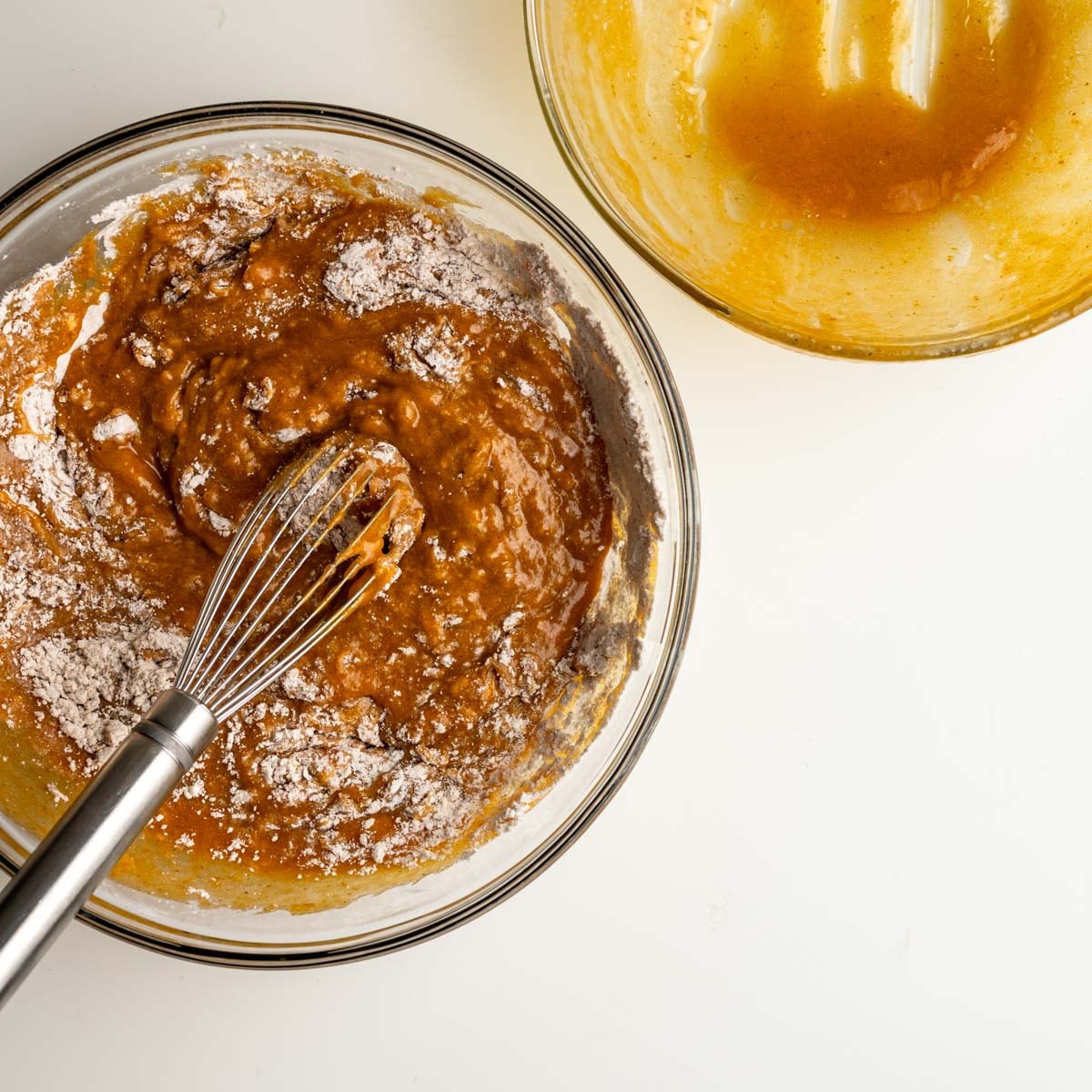 combing both wet and dry ingredients with a whisk.