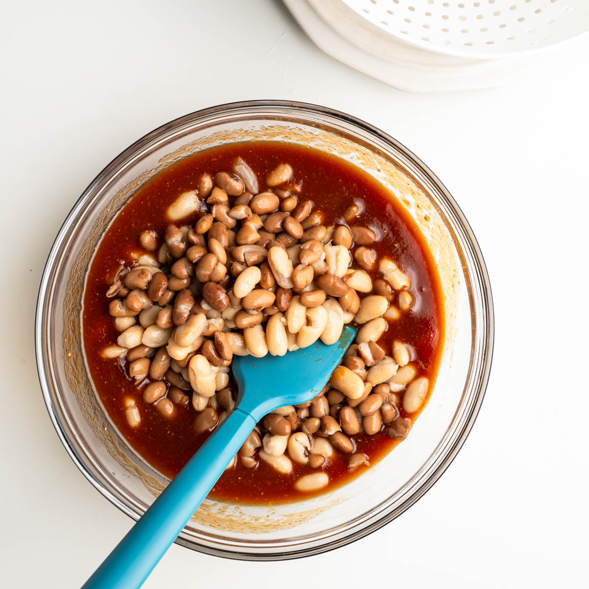 drained beans into the baked bean sauce.