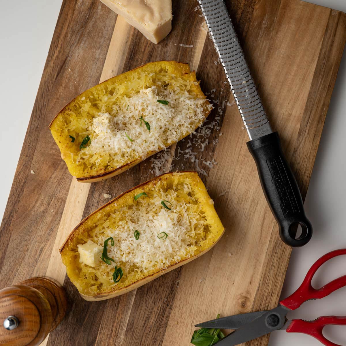 cooked spaghetti squash with butter and topped with freshly grated parmesan cheese.