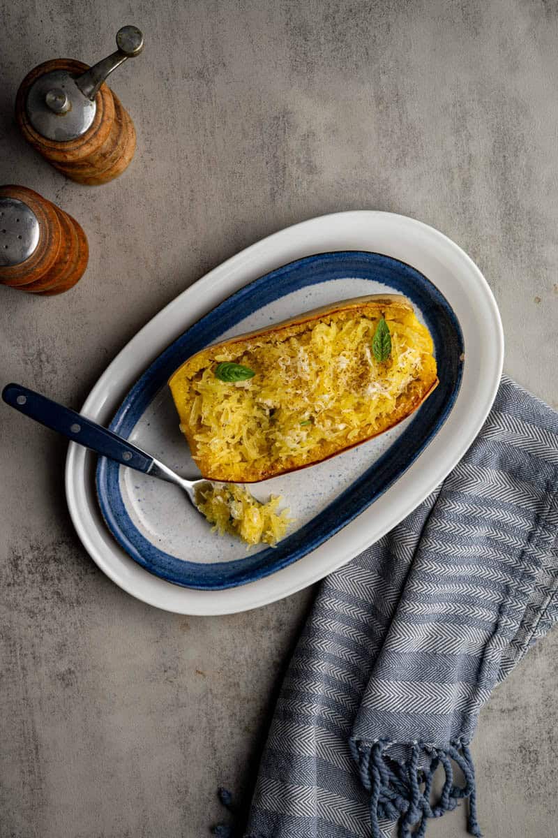 spaghetti squash served on a platter with a fork.