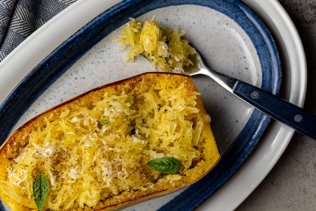 close up of baked low FODMAP spaghetti squash with a bite on a fork.