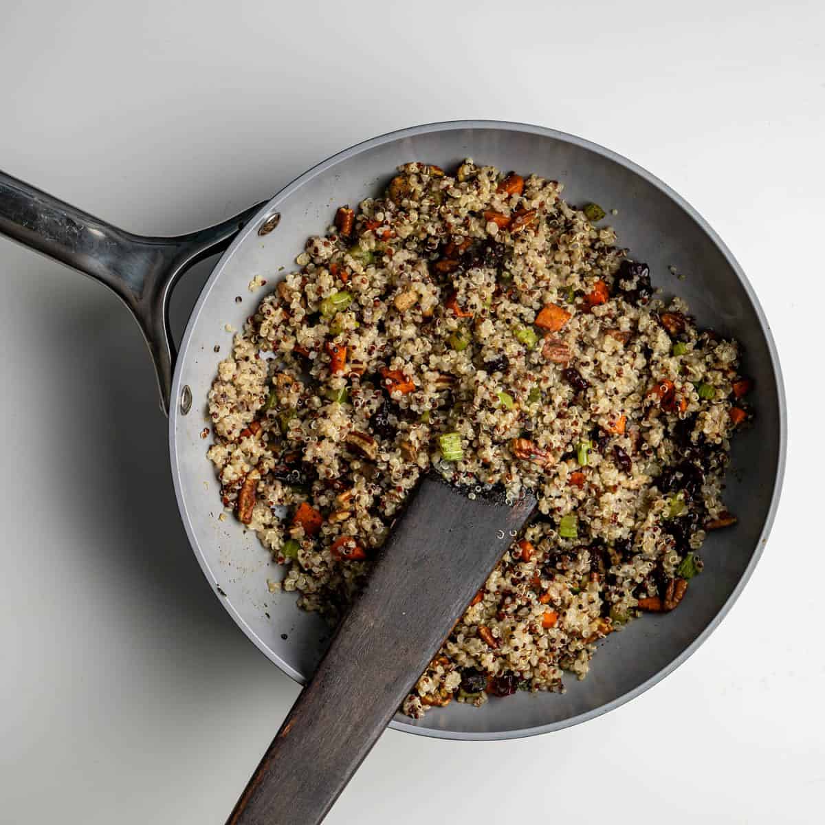 cooked qunioa added to the sauted vegetables, pecans and cranberries.